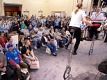 Trade Show Jugglers Scott Meltzer & Katrine Spang-Hanssen on six foot unicycles for HP